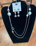 Coronet double layer necklace set made with a 30’ silver tone chain. Matching earrings 
